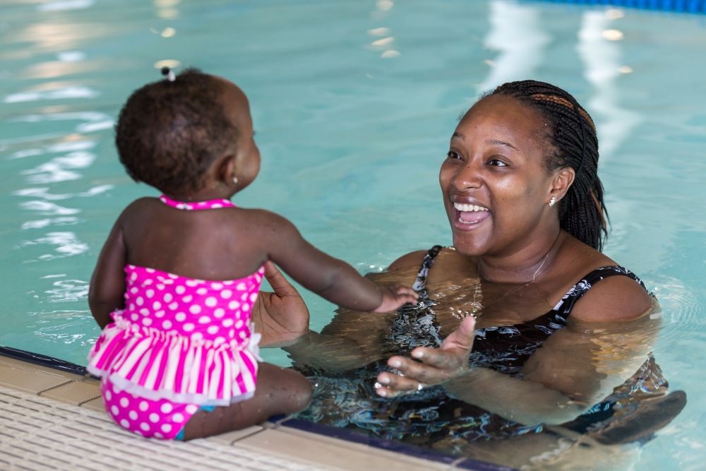 Mother and baby swimming