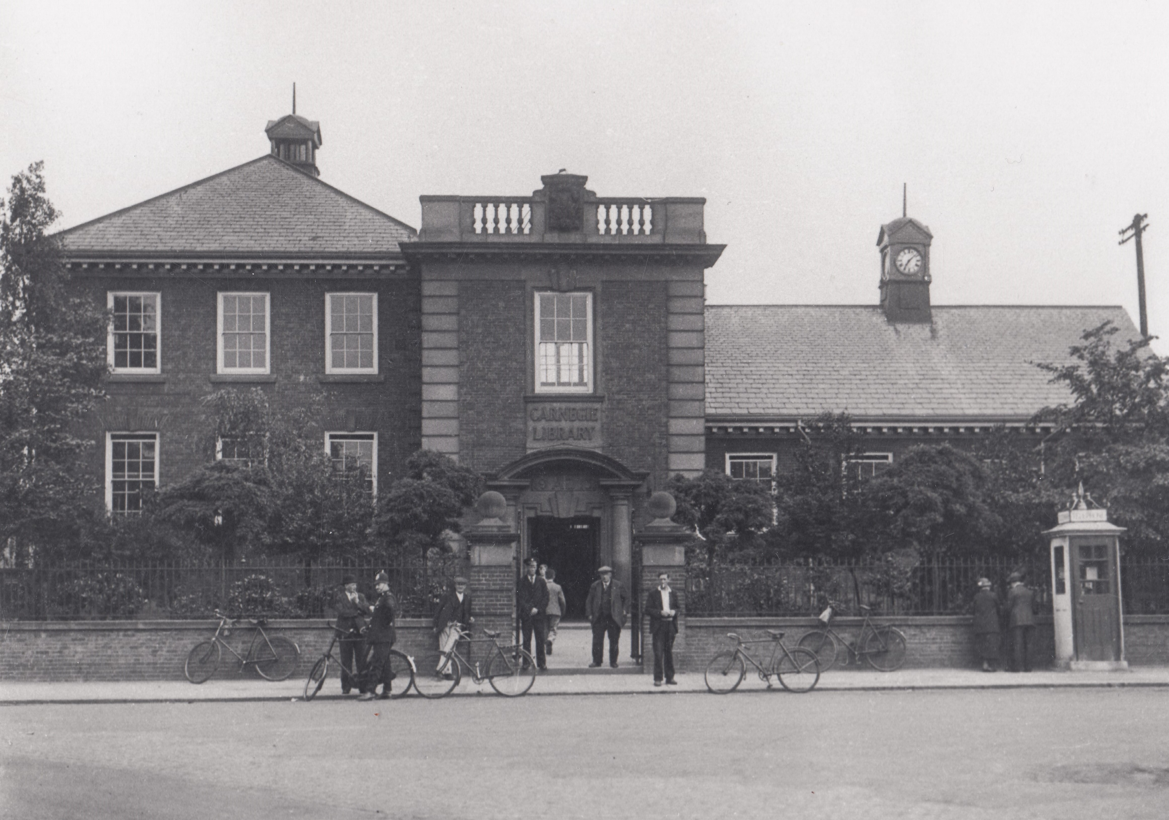 old pear tree library in 1916 buildings attached in black and white photo