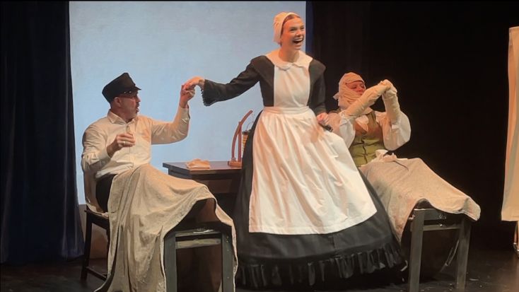 A performer dressed as Florence Nightingale.