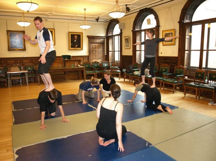 Young performers rehearse in a studio space.
