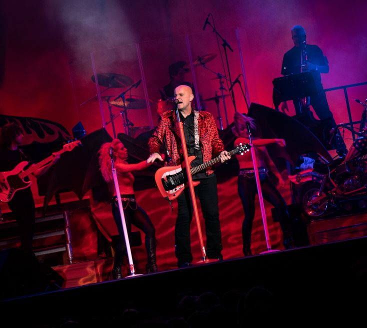 Anything for Love The Meat Loaf Story. Red background with Steve Steinman 