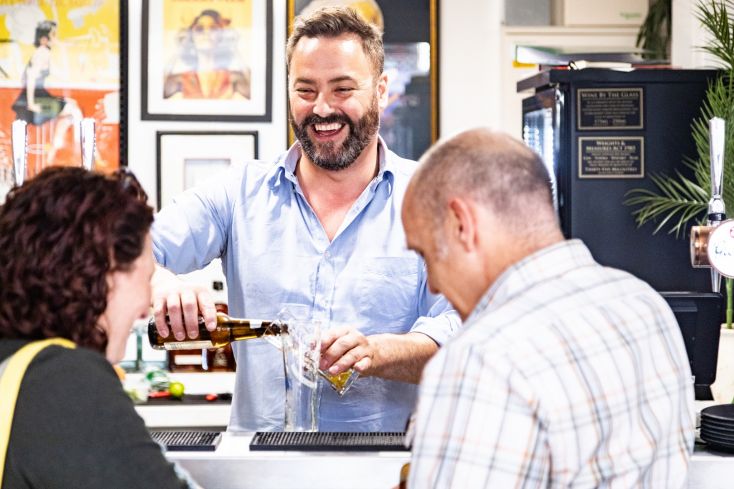 Bartender serving drinks at Market Porter