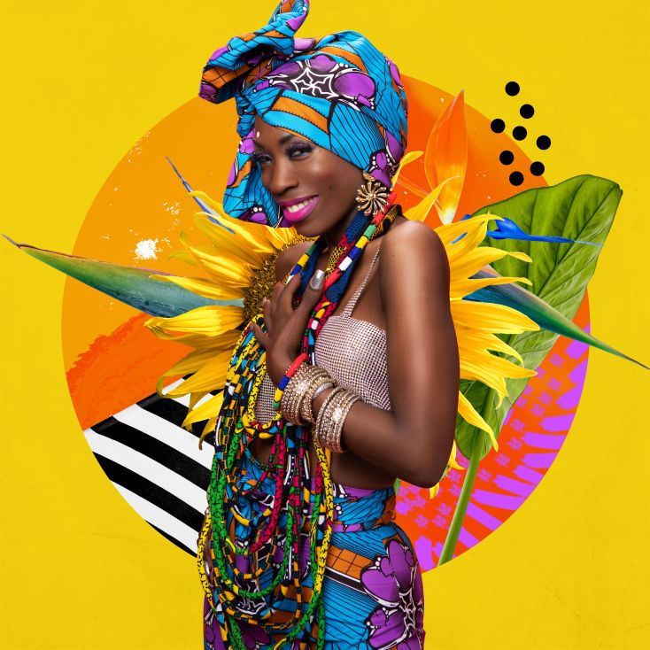 Heather Small stands against a yellow backdrop