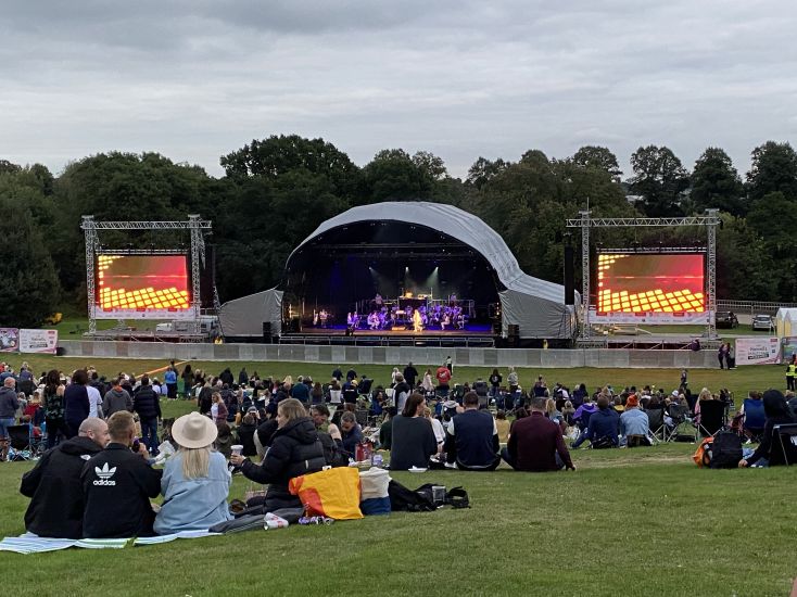 Crowds gather at an outdoor concert