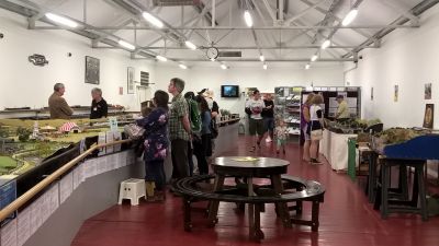Customers of all ages gathered in exhibit viewing model railways